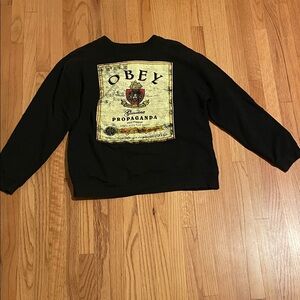 Obey Black Crewneck Sweatshirt with Yellow Graphic Back Patch